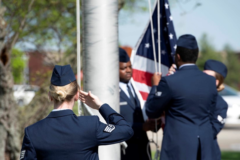 Airman Saluting Flag